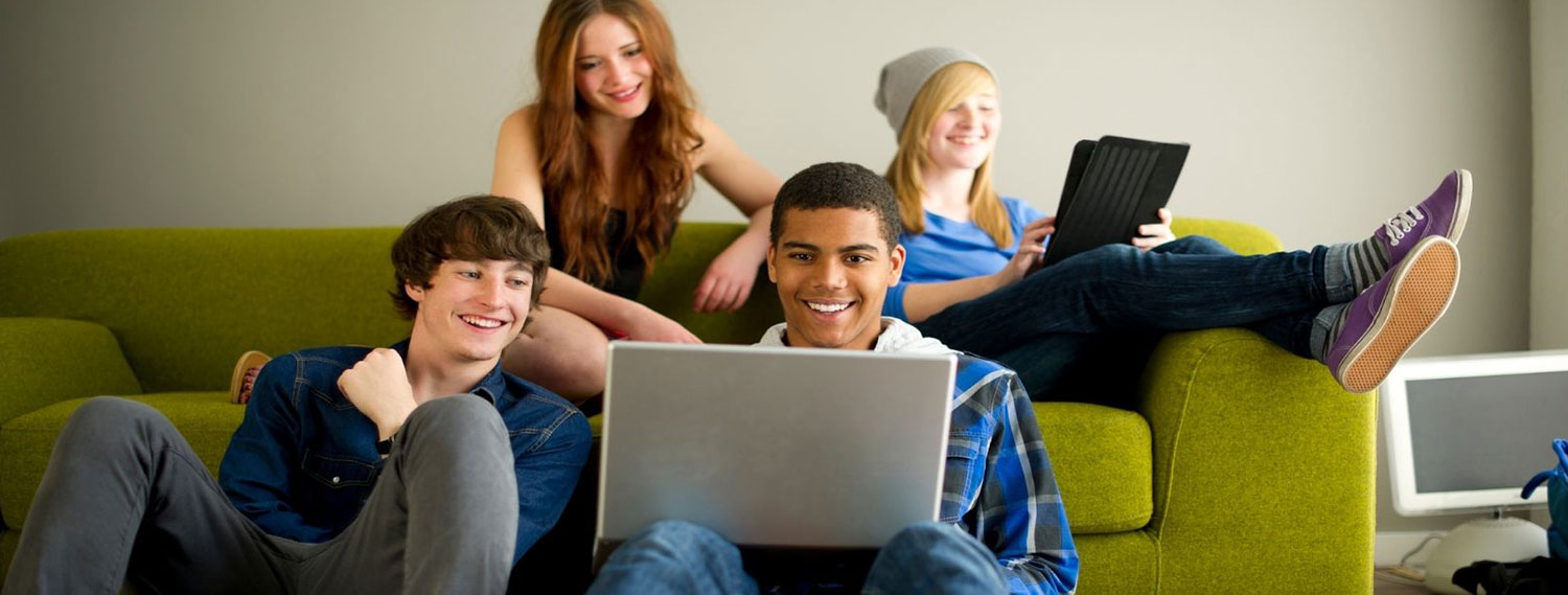 A group of kid's browsing on their computers.